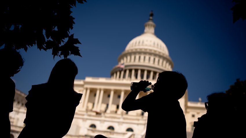 WASHINGTON, DC – JUNE 21: A young visitor to the U.S. Capitol Building takes a drink in the shade as much of the Northeast braces for a heat wave on June 21, 2024 in Washington, DC. Temperatures are forecasted to soar into the high 90s, with a heat index surpassing 100 degrees. (Photo by Andrew Harnik/Getty Images)