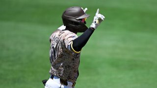 SAN DIEGO, CA – JULY 7:  Jurickson Profar #10 of the San Diego Padres points skyward after hitting a solo home run during the first inning of a baseball game against the Arizona Diamondbacks at Petco Park on July 7, 2024 in San Diego, California. (Photo by Denis Poroy/Getty Images)