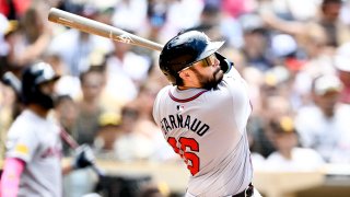 SAN DIEGO, CA – JULY 14: Travis d’Arnaud #16 of the Atlanta Braves hits a three-run home run during the sixth inning of a baseball game against the San Diego Padres at Petco Park on July 14, 2024 in San Diego, California. (Photo by Denis Poroy/Getty Images)