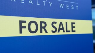 A 'for sale' sign is shown in front of a home in the San Carlos neighborhood of San Diego, July 3, 2024.