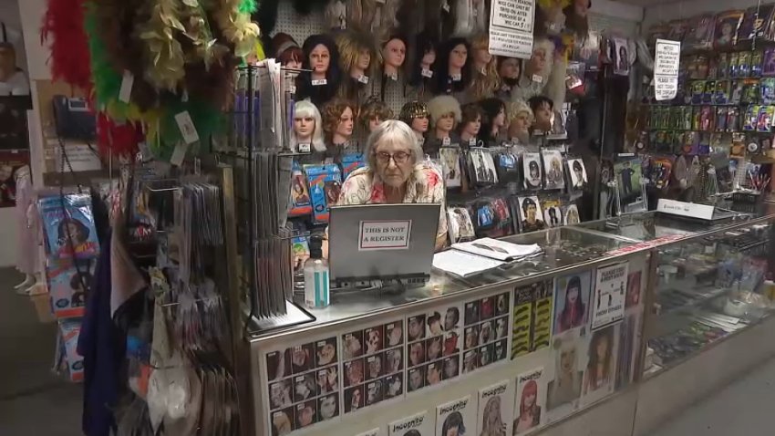 Ursula Boschet, owner of Ursula's Costumes in Santa Monica, sits in her shop during an interview with NBC4 on Tuesday, July 16, 2024.