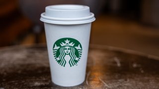 A Starbucks coffee cup sits on a table at a store in Manhattan, New York City, on Jan. 30, 2024.