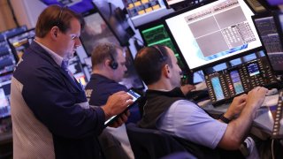 Traders work on the floor of the New York Stock Exchange during morning trading on May 31, 2024 in New York City. 