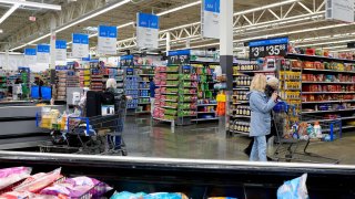 Customers shop for groceries at a Walmart store in Secaucus, New Jersey, US, on Tuesday, March 5, 2024.