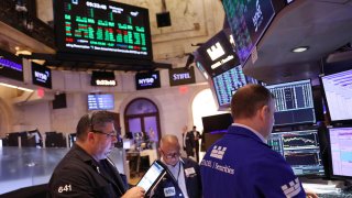 Traders work on the floor of the New York Stock Exchange during morning trading on July 31, 2024 in New York City.