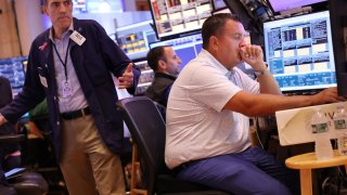 Traders work on the floor of the New York Stock Exchange during afternoon trading on August 02, 2024 in New York City. 