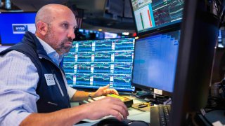 A trader works on the floor of the New York Stock Exchange.