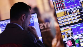 Traders work on the floor of the New York Stock Exchange during afternoon trading on August 05, 2024 in New York City. 