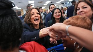 Democratic presidential candidate U.S. Vice President Kamala Harris greets audience members at a campaign rally at United Auto Workers Local 900 on August 8, 2024 in Wayne, Michigan. 