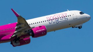 Wizz Air Malta Airbus A321 neo aircraft spotted at Eindhoven Airport during taxiing, taking off and flying phase in the blue sky.Β