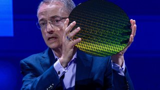 Pat Gelsinger, chief executive officer of Intel Corp., holds a wafer as he speaks at the Computex conference in Taipei, Taiwan, on Tuesday, June 4, 2024. 