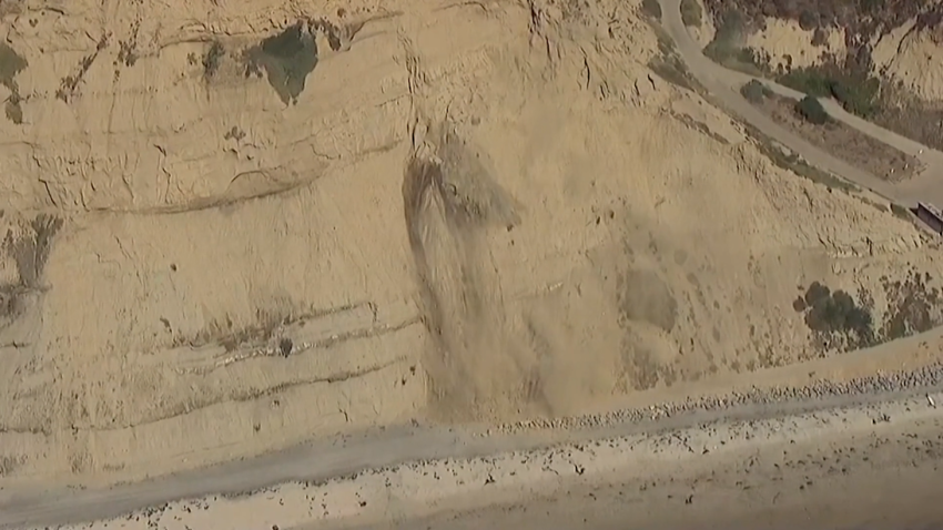 A portion of the bluff above the beach in Torrey Pines collapsed on Monday.