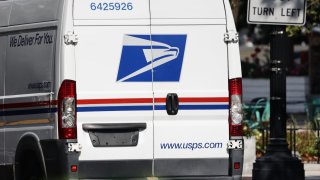 FILE - US Postal truck