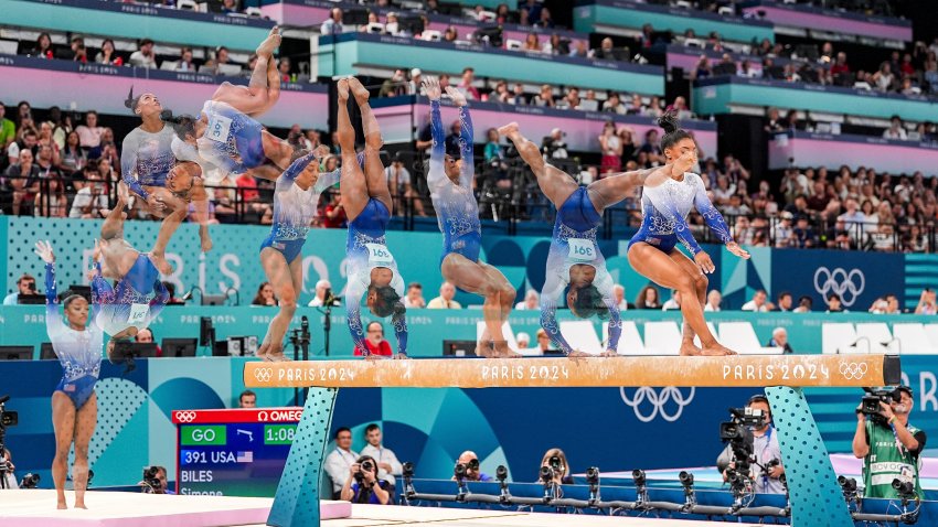 a time lapse of biles on beam