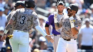 SAN DIEGO, CALIFORNIA – AUGUST 04: David Peralta #24 of the San Diego Padres is congratulated by Xander Bogaerts #2 and Jackson Merrill #3 after hitting a three-run home run against the Colorado Rockies during the sixth inning at Petco Park on August 04, 2024 in San Diego, California. (Photo by Orlando Ramirez/Getty Images)