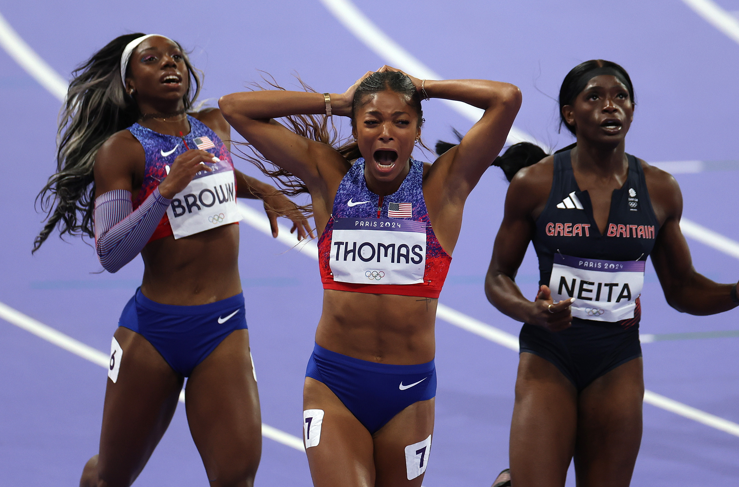 American Gabby Thomas, of Northampton, Massachusetts, celebrates after winning the women's 200m at the Stade de France on inal on day eleven of the Olympic Games Paris 2024, Tuesday, Aug. 6, 2024.