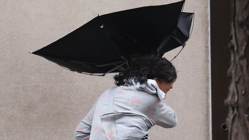 File. People use umbrellas as they battle wind and rain amid a storm on August 09, 2024 in New York City.