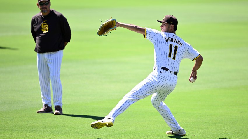 SAN DIEGO, CALIFORNIA – AUGUST 23: Yu Darvish #11 of the San Diego Padres throws in the outfield as Ruben Niebla #57 looks onbefore the game against the New York Mets at Petco Park on August 23, 2024 in San Diego, California. (Photo by Orlando Ramirez/Getty Images)