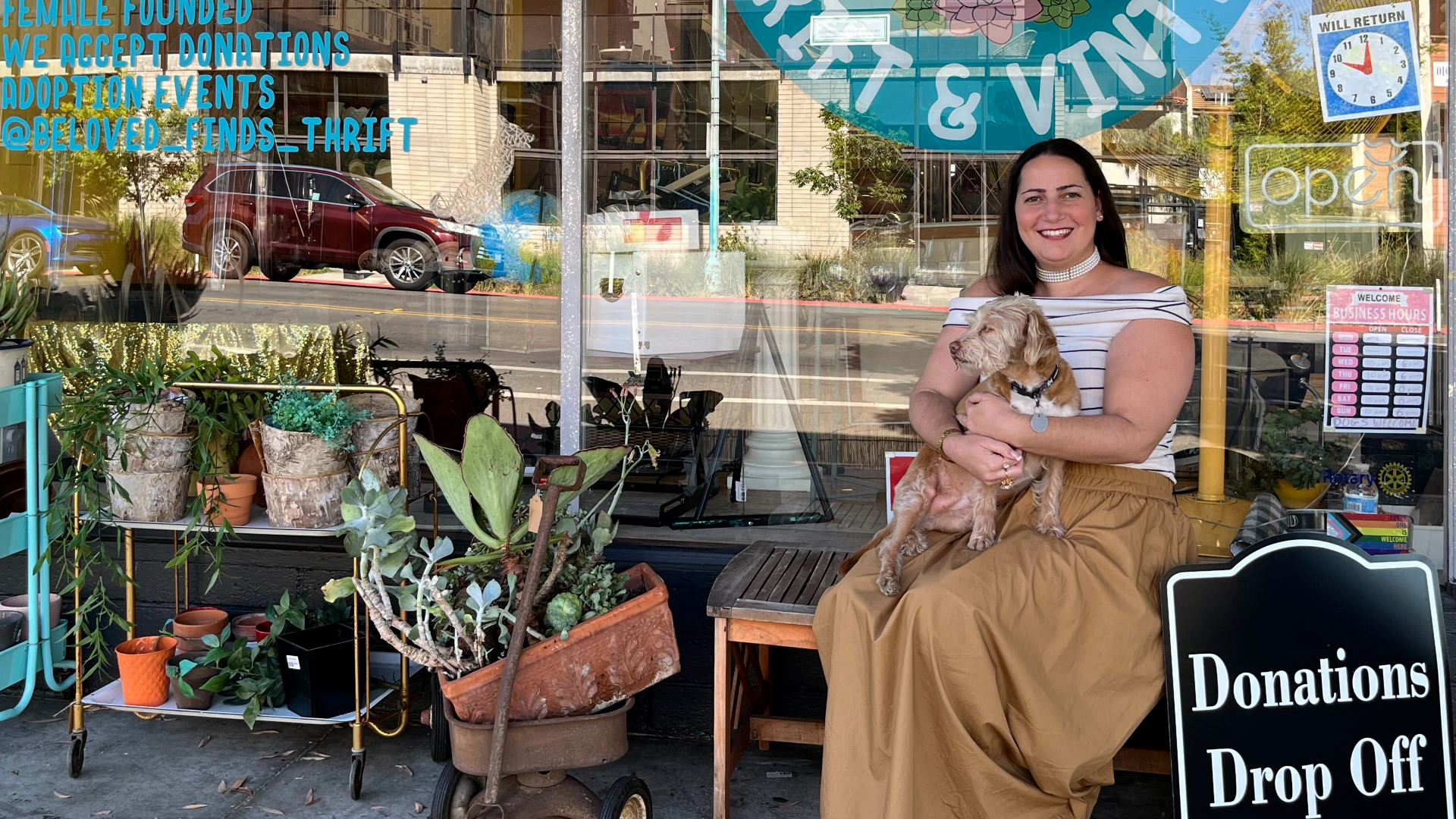 Susan Kaplan, owner of BeLoved Finds Thrift & Vintage in North Park, sits in front of her store on Aug. 21, 2024.