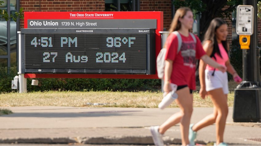 Aug 26, 2024; Columbus, Ohio, USA; Temperatures in the mid-90s are displayed on the digital thermometer outside the Ohio Union on the campus of Ohio State University. Columbus is under a heat advisory through Wednesday with heat index values expected to reach up to 102.