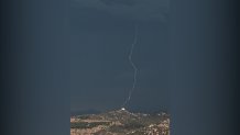 Ground strike lightning from thunderstorm in East County, photographed in Santee on Aug. 1, 2024.