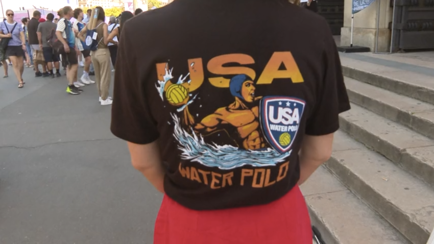 Alex Bowen's fiancé, Hilary Hanson, wears a Team USA water polo shirt, designed by Coronado-based brand URT.