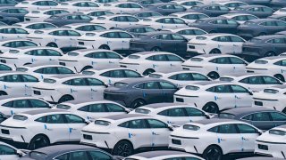 Rows of new energy vehicles are parked at Changan Automobile’s vehicle distribution center in Chongqing, China, on January 14, 2024. 