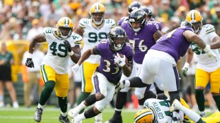 Running back John Kelly Jr. #33 of the Baltimore Ravens carries the ball during the second quarter of an NFL preseason football game against the Green Bay Packers, at Lambeau Field on August 24, 2024 in Green Bay, Wisconsin.