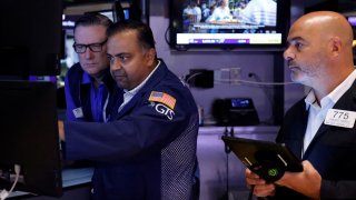 Traders work on the floor at the New York Stock Exchange on Aug. 30, 2024.