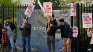 Boeing factory workers and supporters gather on a picket line during the third day of a strike near the entrance to a Boeing production facility in Renton, Washington, U.S. September 15, 2024. 