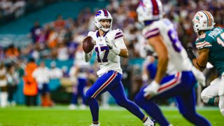 Josh Allen #17 of the Buffalo Bills scrambles out of the pocket during an NFL football game against the Miami Dolphins at Hard Rock Stadium on September 12, 2024 in Miami Gardens, Florida.