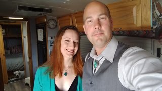 Courtney and I dressed up for a friend’s wedding with our dog, Penny, photo bombing us from the bedroom.