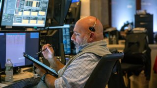 Traders work on the floor of the New York Stock Exchange (NYSE) on September 19, 2024, in New York City. 