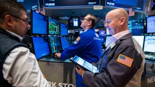 Traders work on the floor of the NYSE. 