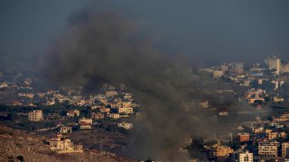 Smoke rises from an Israeli airstrike.