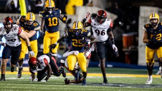 California running back Jaivian Thomas (25) rushes up the field as San Diego State safety William Nimmo Jr. (7) tackles during the first half of their NCAA football game in Berkeley, Calif., Saturday, Sept. 14, 2024. (Photo by Stephen Lam/San Francisco Chronicle via Getty Images)