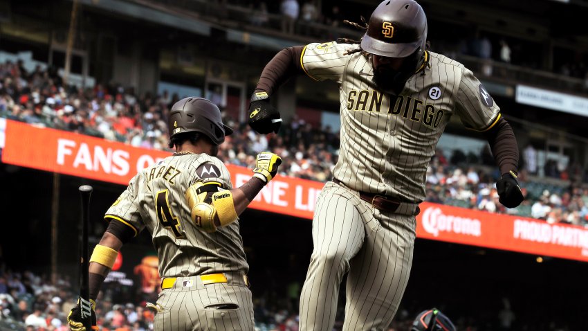 Fernando Tatis Jr. (21) celebrates his solo homerun with Luis Arraez (4) in the eighth inning as the San Francisco Giants played the San Diego Padres at Oracle Park in San Francisco, on Sunday, Sept. 15, 2024, The Padres defeated the Giants 4-3 in 10 innings. (Photo by Carlos Avila Gonzalez/San Francisco Chronicle via Getty Images)