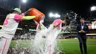 SAN DIEGO, CA – SEPTEMBER 20: Fernando Tatis Jr. (R) #23 of the San Diego Padres has a cooler dumped on him by teammate Manny Machado #13 after he hit a walk-off double during a baseball game against the Chicago White Sox at Petco Park September 20, 2024 in San Diego, California. (Photo by Denis Poroy/Getty Images)