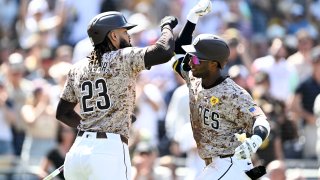 SAN DIEGO, CA – SEPTEMBER 22: Jurickson Profar #10 of the San Diego Padres is congratulated by Fernando Tatis Jr. #23 after hitting a solo home run during the third inning of a baseball game against the Chicago White Sox, September 22, 2024 at Petco Park in San Diego, California. (Photo by Denis Poroy/Getty Images)