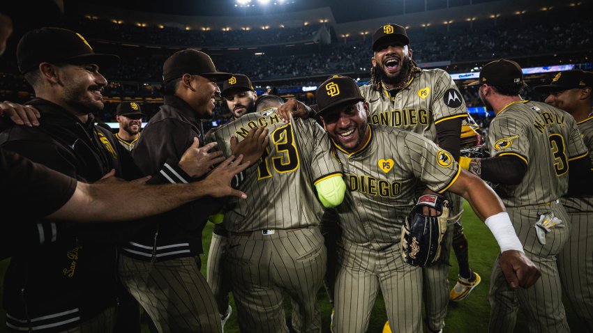 LOS ANGELES, CALIFORNIA – SEPTEMBER 24: The San Diego Padres celebrate after defeating the Los Angeles Dodgers and securing a Post-Season bid at Dodger Stadium on September 24, 2024 in Los Angeles, California. (Photo by Matt Thomas/San Diego Padres/Getty Images)