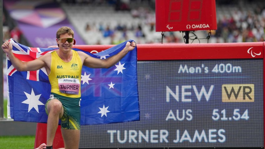 Australia’s James Turner celebrates after winning the men’s 400 m. T36 and setting a new world record during the 2024 Paralympics, Tuesday, Sept. 3, 2024, in Paris, France. (AP Photo/Thibault Camus)