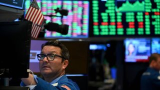 A trader works during the closing bell at the New York Stock Exchange on March 17, 2020.