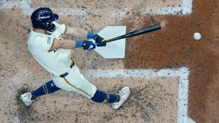 Milwaukee Brewers’ Sal Frelick hits a double during the fourth inning of Game 2 of a National League wild card baseball game against the New York Mets Tuesday, Oct. 1, 2024, in Milwaukee.