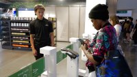 Customers wait to enter a concession stand equipped with Amazon’s Just Walk Out technology at Climate Pledge Arena in Seattle, Washington, on August 22.