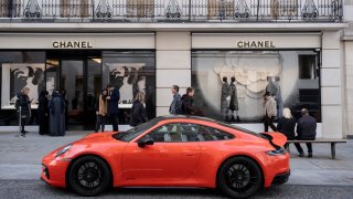 High end Porsche 911 Carrrera GTS car parked outside the Chanel store on Bond Street on 16th October 2023 in London, United Kingdom. 