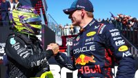 Race winner Lewis Hamilton of Great Britain and Mercedes and Second placed Max Verstappen of the Netherlands and Oracle Red Bull Racing celebrate in parc ferme during the F1 Grand Prix of Great Britain at Silverstone Circuit on July 07, 2024 in Northampton, England.