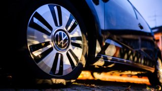 A Volkswagen logo on the rim of an e-up. electric car tire.