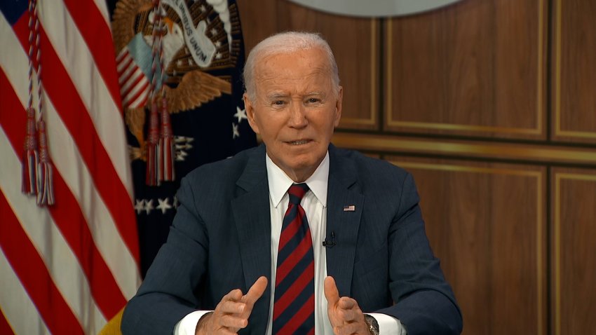 Joe Biden speaks at a desk