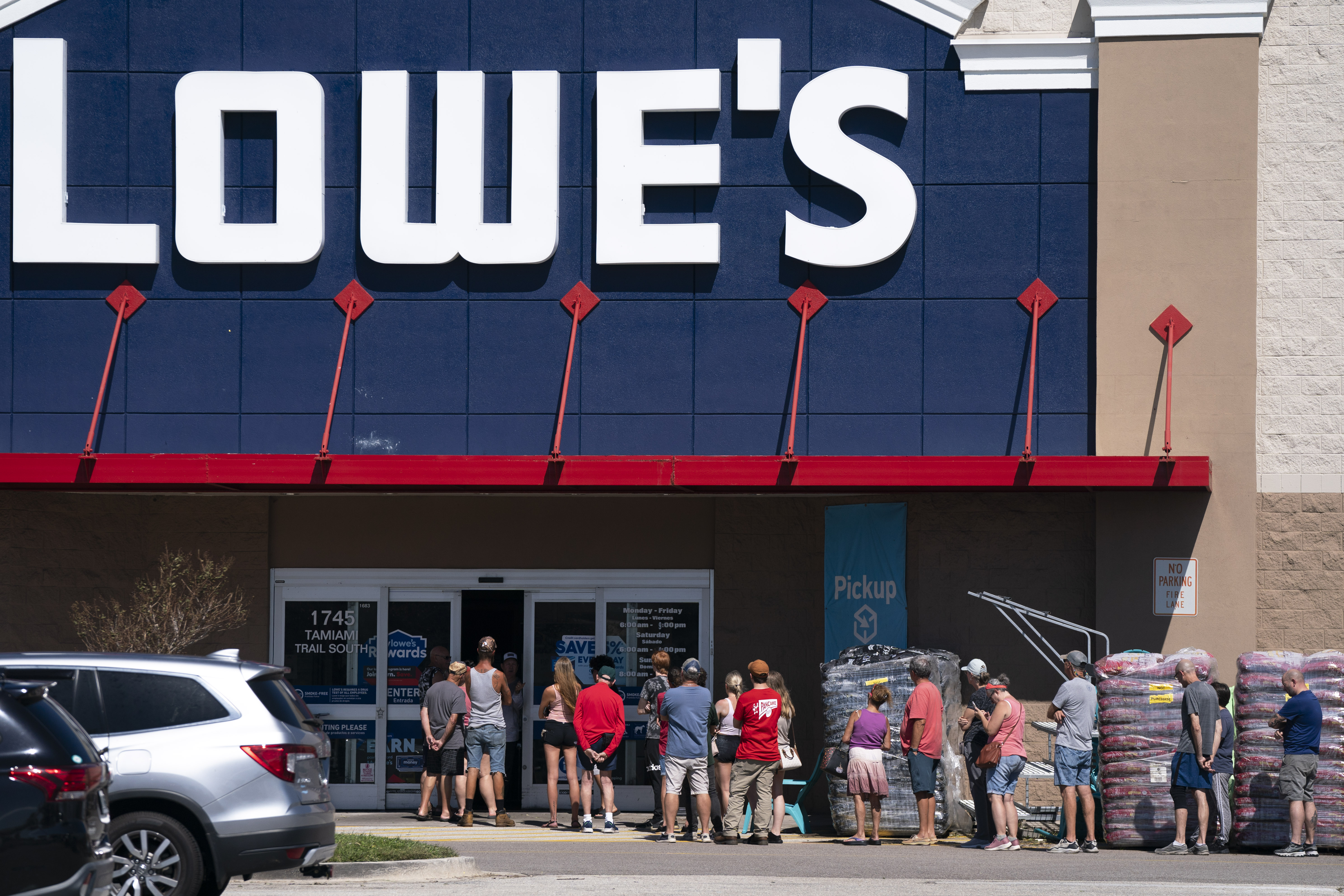 People wait in line outside Lowes in the aftermath of Hurricane Milton on Oct. 10, 2024 in Englewood, Fla.