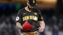 LOS ANGELES, CALIFORNIA - OCTOBER 06: Tanner Scott #66 of the San Diego Padres walks across the field in the eighth inning against the Los Angeles Dodgers during Game Two of the Division Series at Dodger Stadium on October 06, 2024 in Los Angeles, California. (Photo by Orlando Ramirez/Getty Images)